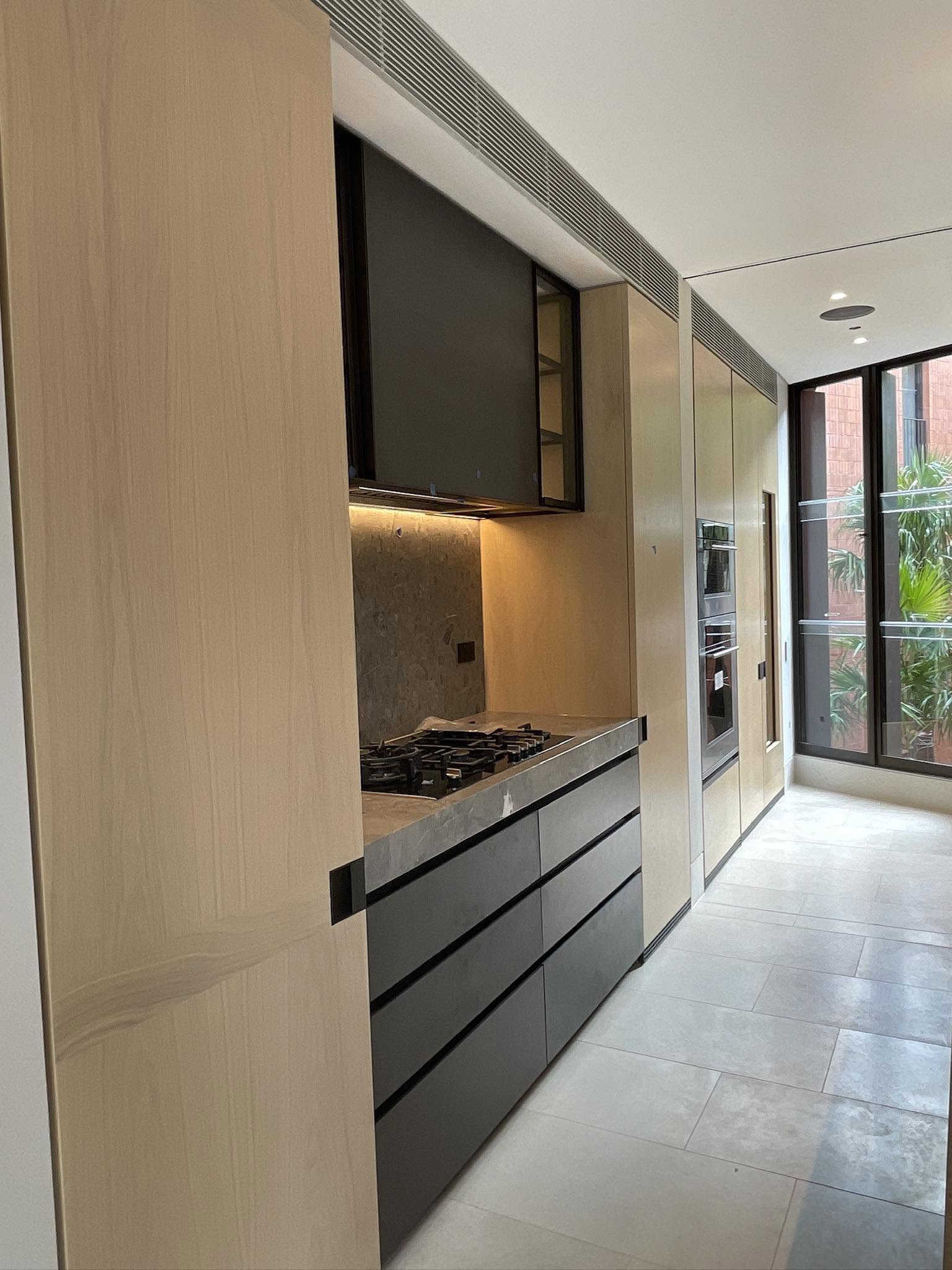 Premium kitchen cabinetry with dark lower cabinets